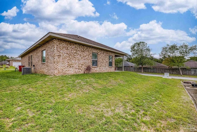 5798 Vendome Ct, Milton, FL 32583 - back of property featuring central AC, fence, brick siding, and a yard