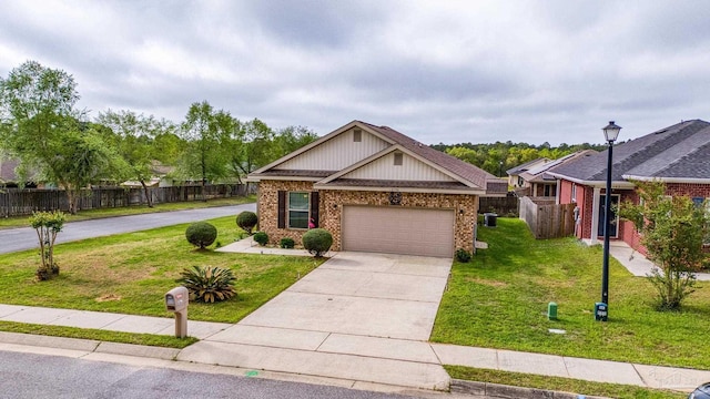 5798 Vendome Ct, Milton, FL 32583 - craftsman-style house featuring fence, an attached garage, concrete driveway, a front yard, and brick siding