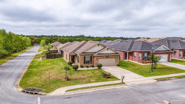 5798 Vendome Ct, Milton, FL 32583 - view of front facade featuring an attached garage, a front lawn, concrete driveway, and brick siding