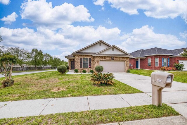 5798 Vendome Ct, Milton, FL 32583 - view of front facade featuring driveway, brick siding, and a front lawn