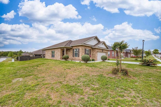 5798 Vendome Ct, Milton, FL 32583 - ranch-style home with fence, an attached garage, brick siding, a front lawn, and driveway