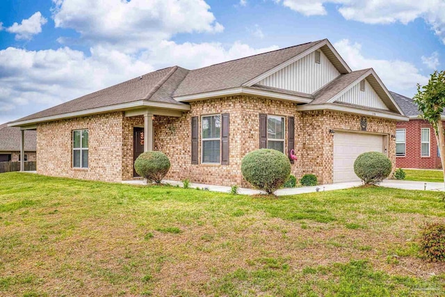 5798 Vendome Ct, Milton, FL 32583 - view of front facade with brick siding, concrete driveway, a garage, and a front lawn