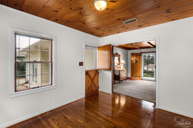 spare room with hardwood / wood-style flooring, crown molding, and wooden ceiling