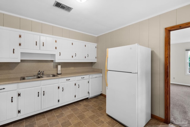 kitchen featuring white cabinetry, ornamental molding, sink, and white appliances