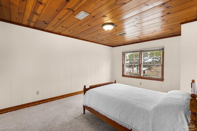 carpeted bedroom with wooden ceiling