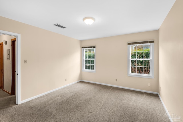 empty room featuring carpet flooring