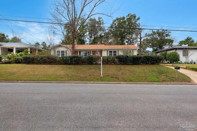 ranch-style house with a front yard