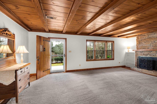 unfurnished living room featuring carpet floors and wood ceiling