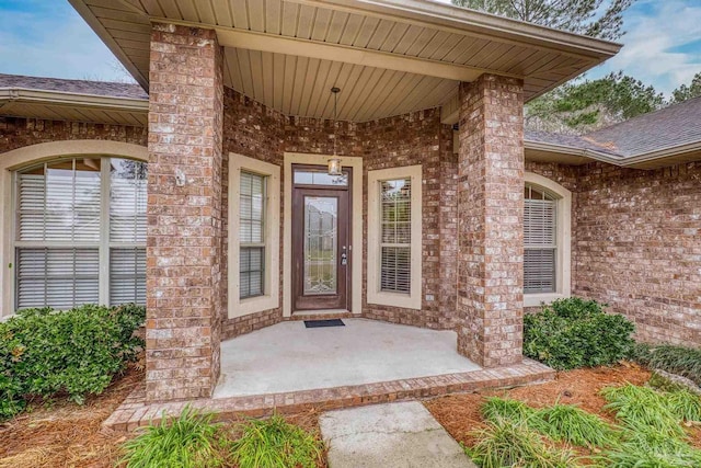 entrance to property featuring a patio area