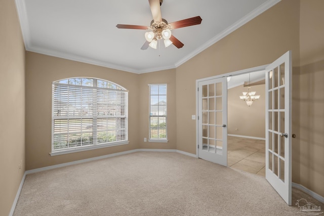 carpeted empty room featuring french doors, ornamental molding, and ceiling fan with notable chandelier