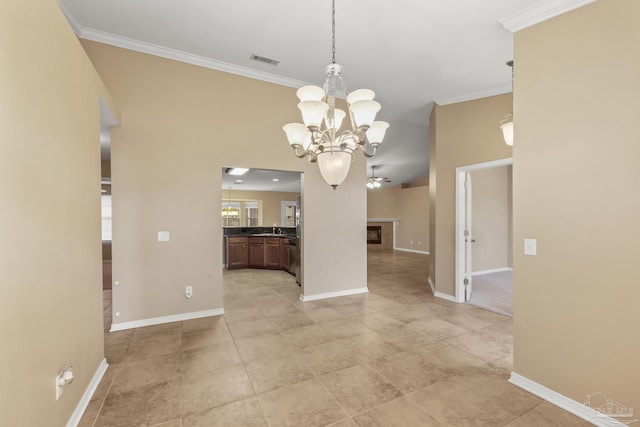 unfurnished dining area featuring sink, crown molding, a chandelier, and light tile patterned flooring