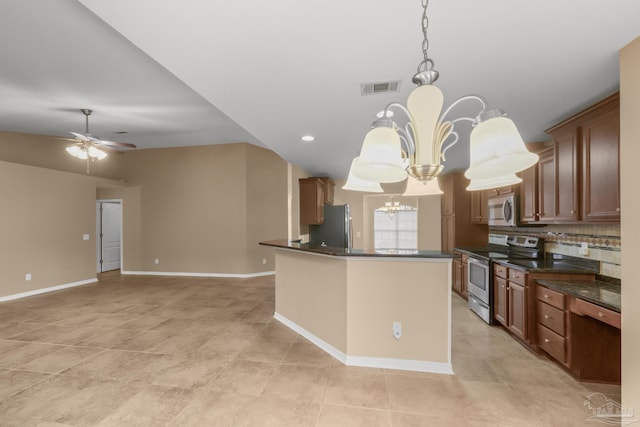 kitchen featuring ceiling fan with notable chandelier, backsplash, hanging light fixtures, a center island, and stainless steel appliances