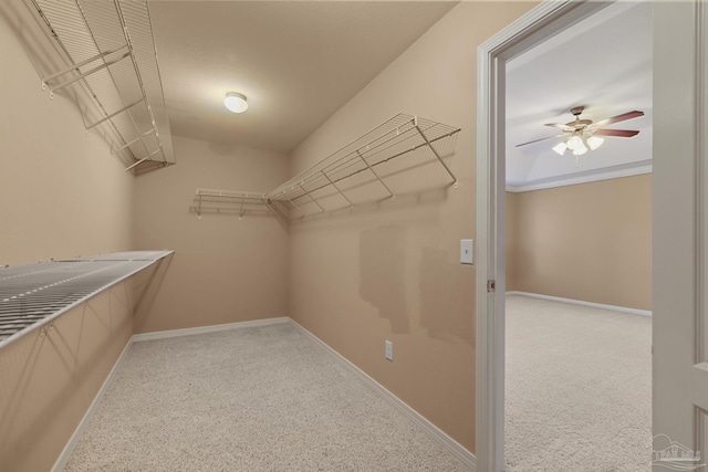 walk in closet featuring ceiling fan