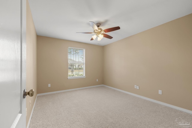 unfurnished room with ceiling fan and carpet floors