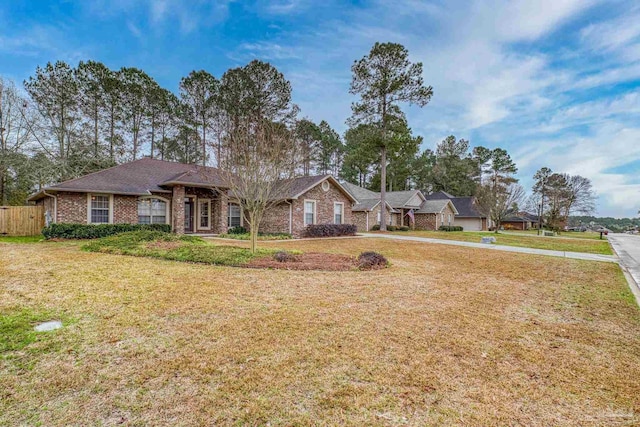 single story home with a front yard