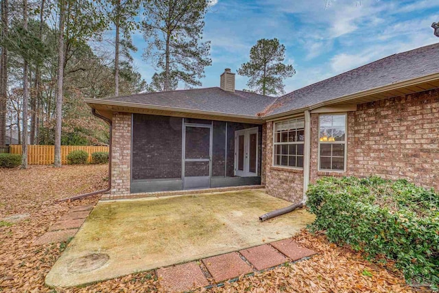 rear view of house with a sunroom