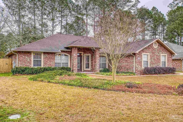 single story home with a front lawn