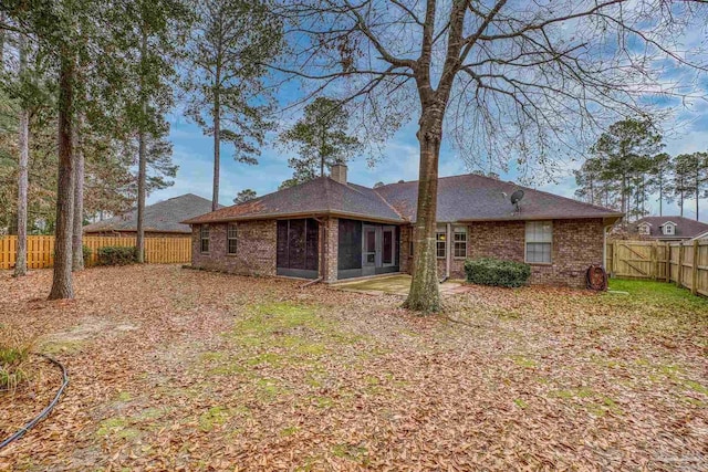 rear view of property featuring a patio