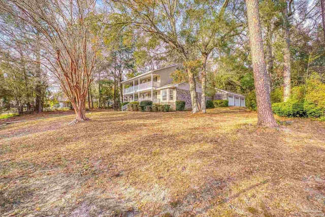 view of yard featuring a sunroom