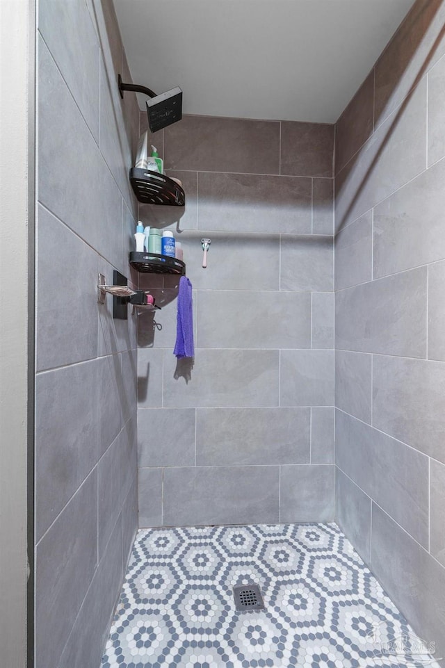 bathroom with a tile shower