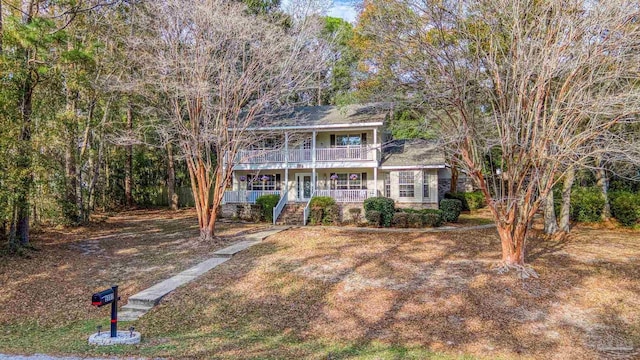 view of front of home with a balcony and covered porch