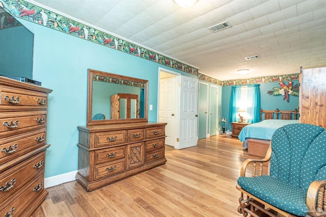 bedroom with light hardwood / wood-style flooring