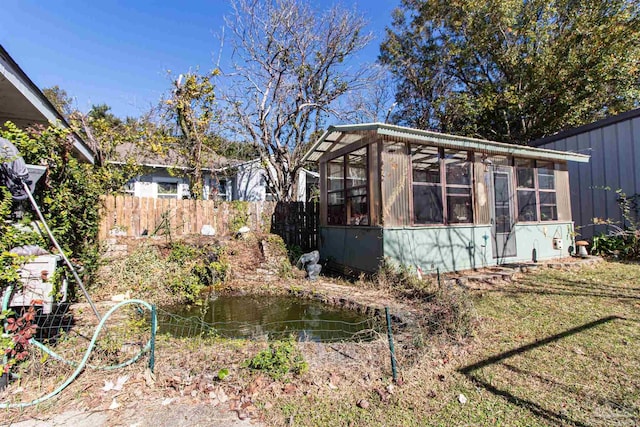 exterior space featuring a sunroom