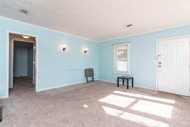 interior space featuring carpet floors and ornamental molding