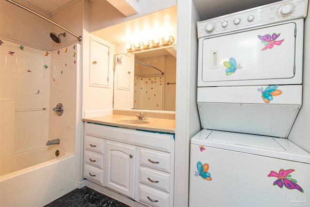 bathroom featuring vanity, shower / bathtub combination, and stacked washer and clothes dryer