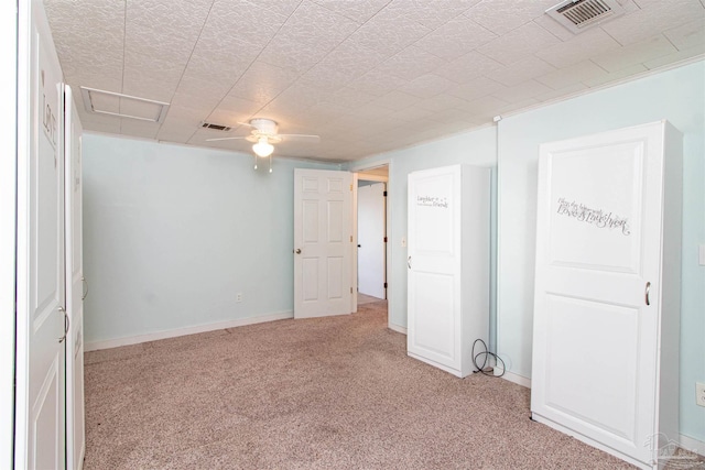 unfurnished room featuring light colored carpet and ceiling fan