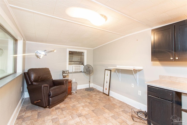 living area featuring crown molding, cooling unit, and vaulted ceiling