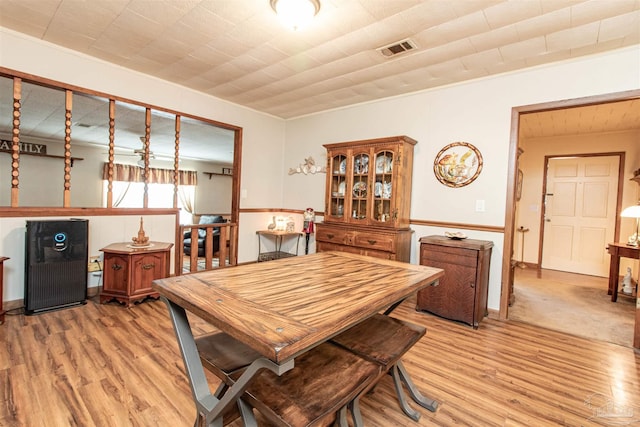 dining area with hardwood / wood-style floors