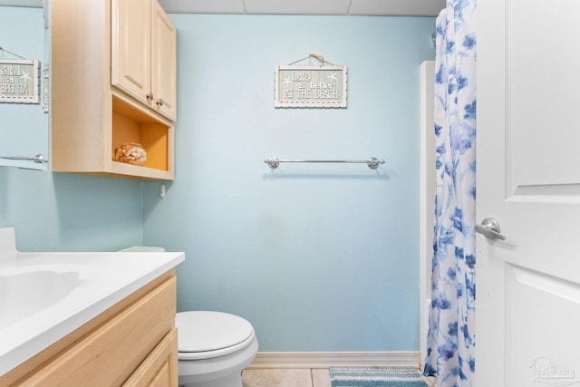 bathroom with vanity, tile patterned flooring, and toilet