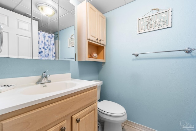 bathroom featuring vanity, toilet, and tile patterned flooring