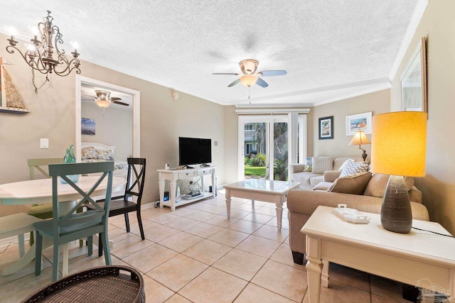 tiled living room featuring ceiling fan with notable chandelier, ornamental molding, and a textured ceiling