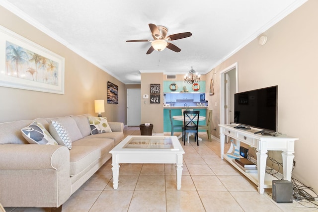 tiled living room featuring ceiling fan with notable chandelier and crown molding