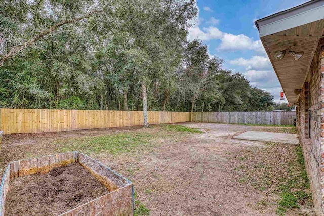 view of yard featuring a fenced backyard