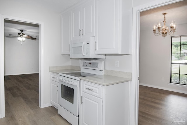 kitchen featuring light wood-style flooring, white appliances, light countertops, and white cabinets