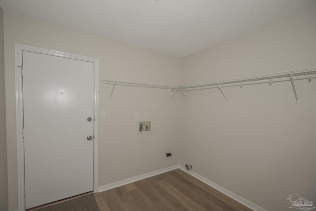 laundry room with laundry area, dark wood-style flooring, baseboards, and washer hookup