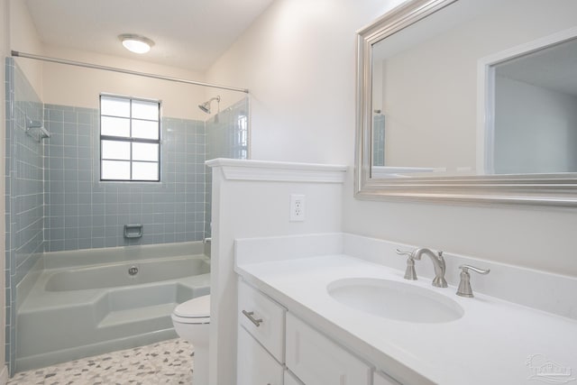 bathroom featuring vanity, toilet, and shower / bath combination
