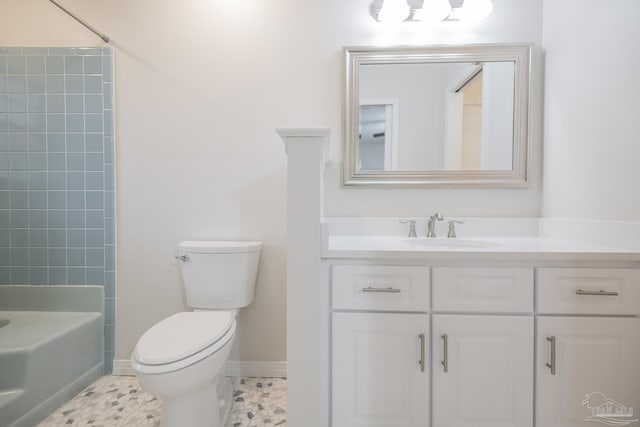 full bathroom featuring vanity, toilet, and baseboards