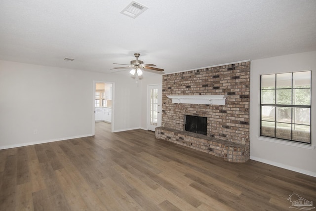 unfurnished living room featuring baseboards, ceiling fan, and wood finished floors