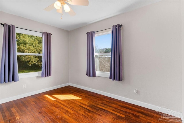 spare room with wood-type flooring and ceiling fan