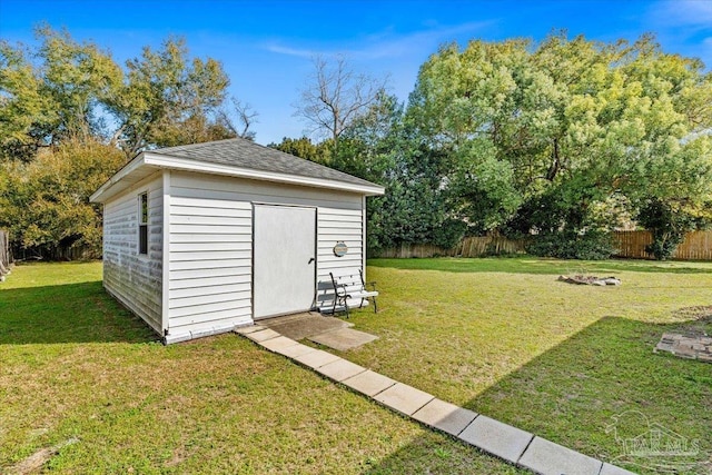 view of outbuilding featuring a lawn