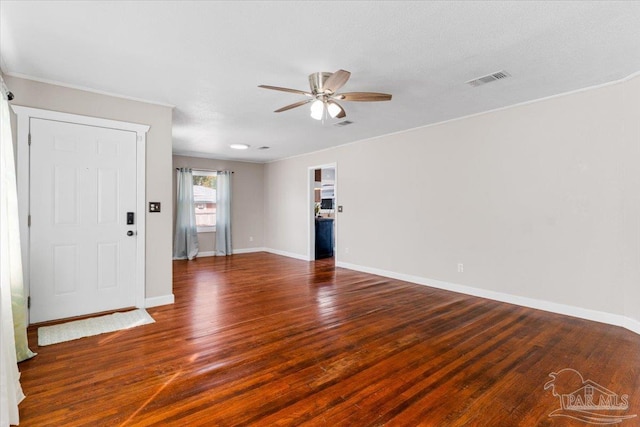 unfurnished room with dark hardwood / wood-style floors and ceiling fan