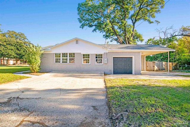 single story home with a garage and a front yard