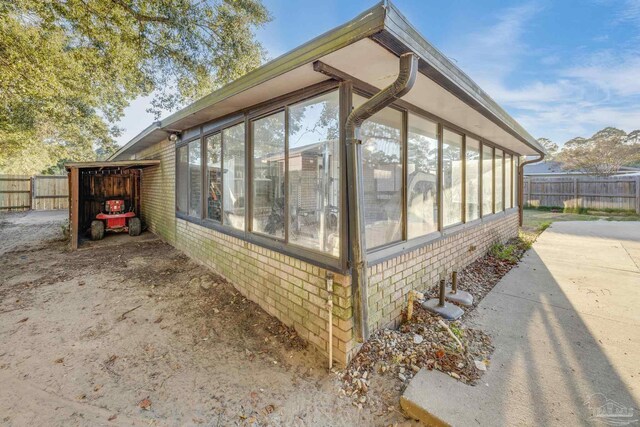 2000 Silverado Rd, Pensacola, FL 32506 - view of property exterior with a sunroom