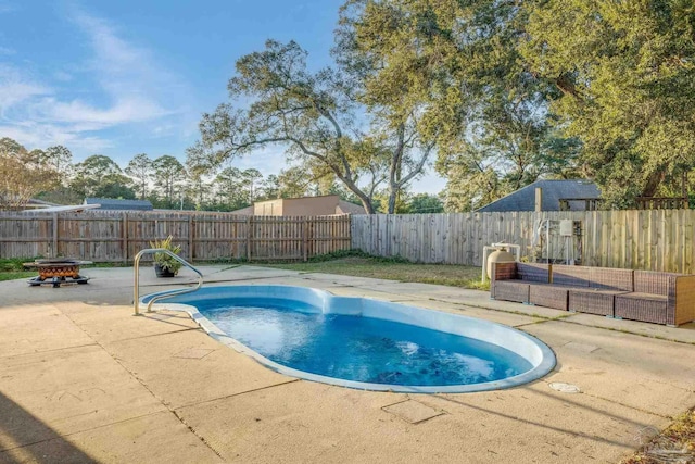 2000 Silverado Rd, Pensacola, FL 32506 - view of pool with a patio area, a fenced backyard, and a fire pit