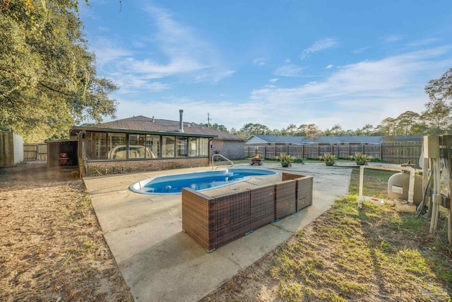 2000 Silverado Rd, Pensacola, FL 32506 - view of swimming pool with a patio, a fenced backyard, and a sunroom