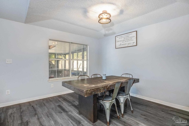 2000 Silverado Rd, Pensacola, FL 32506 - dining area with wood finished floors, a textured ceiling, and baseboards